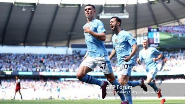 Phil Foden dari Manchester City merayakan gol kedua timnya selama pertandingan Liga Premier antara Manchester City dan West Ham United di Stadion Etihad pada 19 Mei 2024 di Manchester, Inggris. (Foto oleh Naomi Baker/Getty Images)