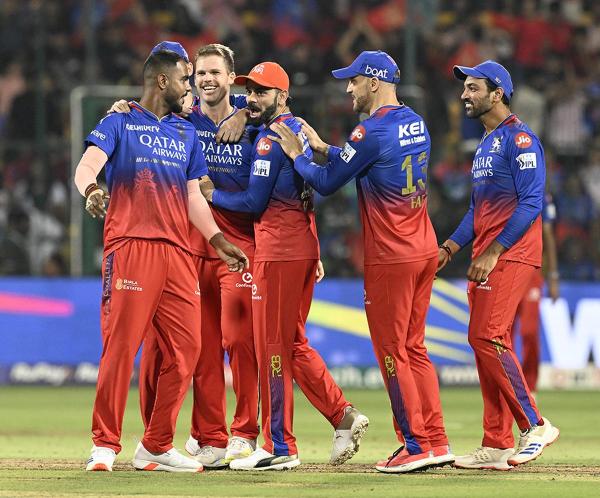 Yash dayal being greeted by team members of RCB after taking the wicket of Abhishek Porel of DC. Yash dayal being greeted by team members of RCB after taking the wicket of Abhishek Porel of DC.