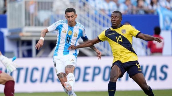 CHICAGO, ILLINOIS - JUNE 09: Angel Di Maria #11 of Argentina scores a goal past Alan Minda #14 of Ecuador in the first half during an International Friendly match at Soldier Field on June 09, 2024 in Chicago, Illinois. (Photo by Patrick McDermott/Getty Images)