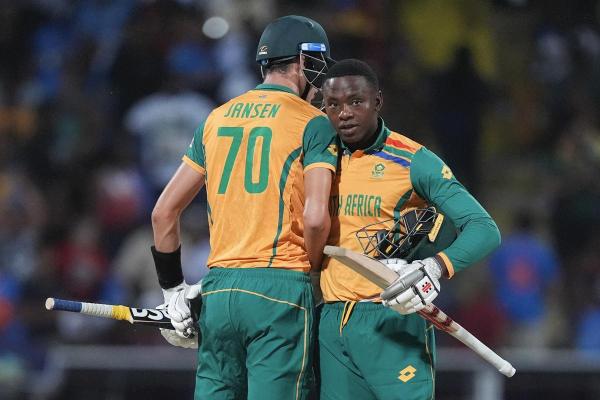 South Africa’s Marco Jansen (L) and teammate Kagiso Rabada celebrate following their win over against West Indies.