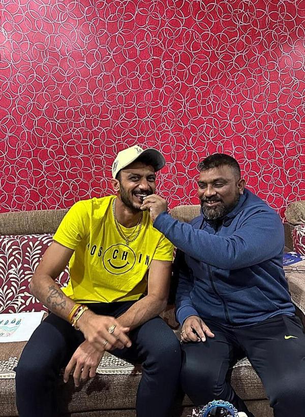 Coach Amrish Patel along with India all-rounder Axar Patel. Coach Amrish Patel along with India all-rounder Axar Patel.
