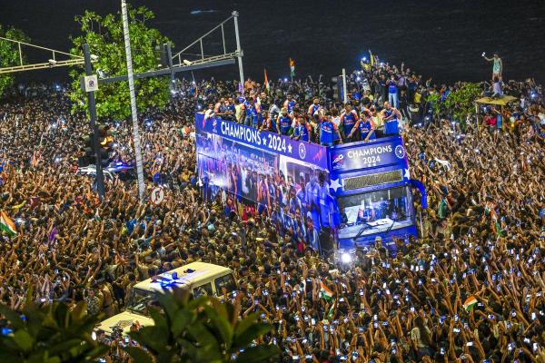 Thousands of fans cheer for the victorious Indian team at the T20 World Cup 2024. Thousands of fans cheer for the victorious Indian team at the T20 World Cup 2024.