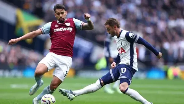 LONDON, ENGLAND - OCTOBER 19: Lucas Paqueta of West Ham United and James Maddison of Tottenham Hotspur in action during the Premier League match between Tottenham Hotspur FC and West Ham United FC at Tottenham Hotspur Stadium on October 19, 2024 in London, England. (Photo by Chloe Knott - Danehouse/Getty Images)