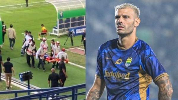 Gelandang Persib Bandung, Tyrone Del Pino (kanan), dievakuasi keluar lapangan setelah terkena tendangan bola Andre Firmansyah, pemain Persebaya Surabaya