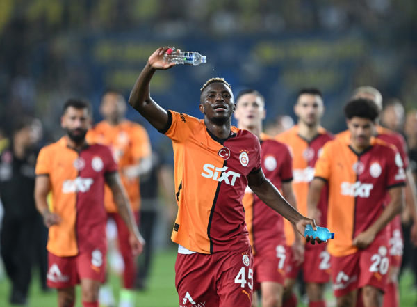 Victor Osimhen (45) of Galatasaray greets fans as he celebrates his team's victory in the Turkish Super Lig match against Fenerbahce at Ulker Stadium in Istanbul