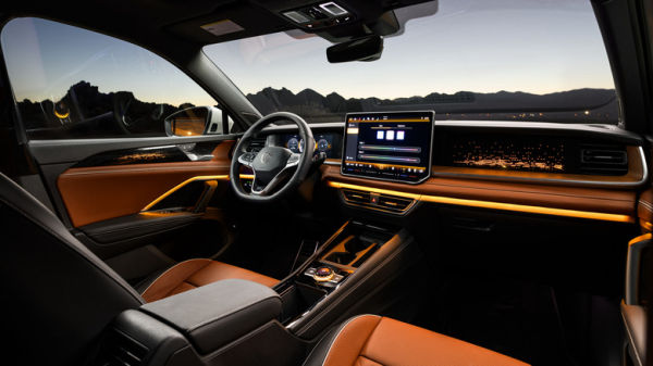 Interior of 2025 Volkswagen Tiguan showing steering wheel, seats, and infotainment screen