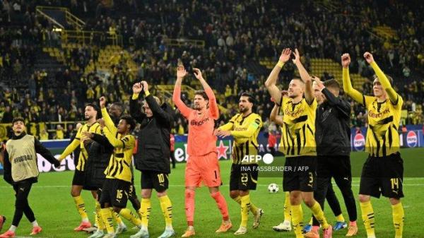 Para pemain Dortmund merayakan kemenangan setelah pertandingan sepak bola Liga Champions UEFA antara Borussia Dortmund dan Celtic di Dortmund, Jerman Barat pada 1 Oktober 2024. (Foto oleh INA FASSBENDER / AFP)