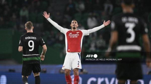 Bek Arsenal Prancis #02 William Saliba (tengah) bereaksi selama Liga Champions UEFA, pertandingan sepak bola fase liga hari ke-5 antara Sporting CP dan Arsenal FC, di stadion Jose Alvalade di Lisbon, pada 26 November 2024. <div class=