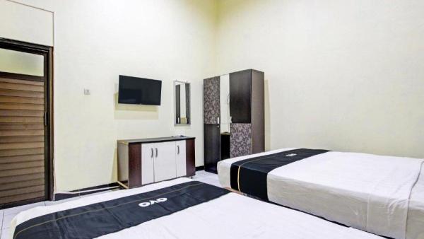 Kamar penginapan di hotel murah Super OYO Capital O 93204 Hotel Mulia Dua Syariah Klaten.