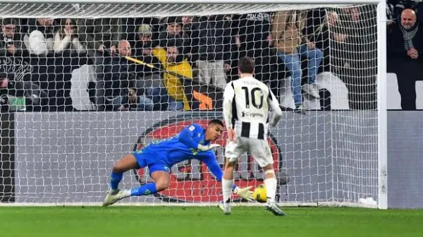 TURIN, ITALY - FEBRUARY 26: Kenan Yildiz of Juventus has his and the team's fourth penalty saved by Devis Vasquez of Empoli in the penalty shoot out during the Coppa Italia Quarter Final match between Juventus FC and Empoli FC at Allianz Stadium on February 26, 2025 in Turin, Italy. <div class=