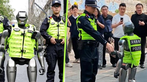 Sebuah video viral menampilkan robot PM01, berjalan dalam formasi dengan petugas polisi dan dengan antusias berjabat tangan dengan orang yang lewat, foto diambil dari YouTube CGTN, 5 Maret 2025.