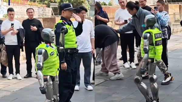 Robot PM01, berjalan bersama petugas polisi dan dengan antusias berjabat tangan dengan orang yang lewat, foto diambil dari YouTube CGTN, 5 Maret 2025.