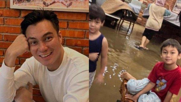 RASAKAN KEBANJIRAN - Meskipun rumah mereka terendam banjir, Kiano dan Kenzo tetap bertahan di sana.