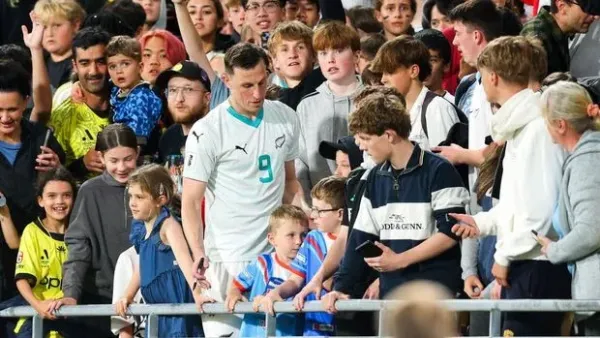 WELLINGTON, NEW ZEALAND - MARCH 21: Chris Wood of New Zealand mixes with fans in the stand during the FIFA World Cup 2026 OFC Qualifier Semi Final match between New Zealand All Whites and Fiji at Sky Stadium on March 21, 2025 in Wellington, New Zealand. (Photo by Hagen Hopkins/Getty Images)