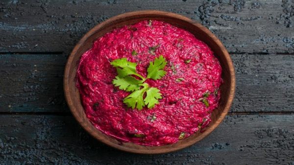 top view beet salad with walnut mayyonaise dark desk
