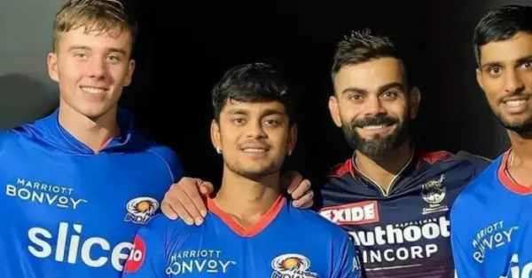 Dewald Brevis with Virat Kohli