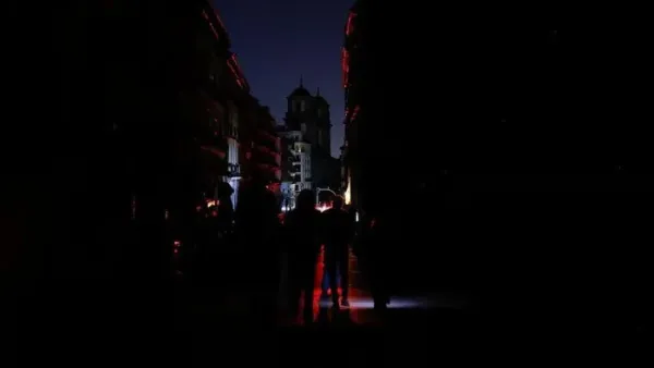 People use flashlights as they walk in the dark during a nationwide power outage in Madrid, Spain, April 28, 2025. REUTERS/Susana Vera Purchase Licensing Rights
