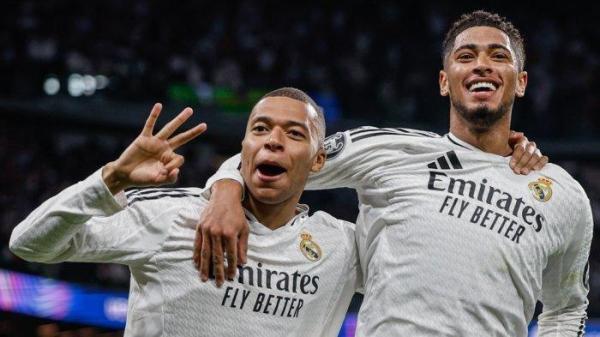 SELEBRASI MBAPE - Selebrasi penyerang Real Madrid, Kylian Mbappe (kiri) bersama Jude Bellingham (kanan) setelah mencetak gol ke gawang Manchester City pada babak play-off 16 besar Liga Champions di Santiago Bernabeu, Kamis (20/2/2025) dini hari WIB.