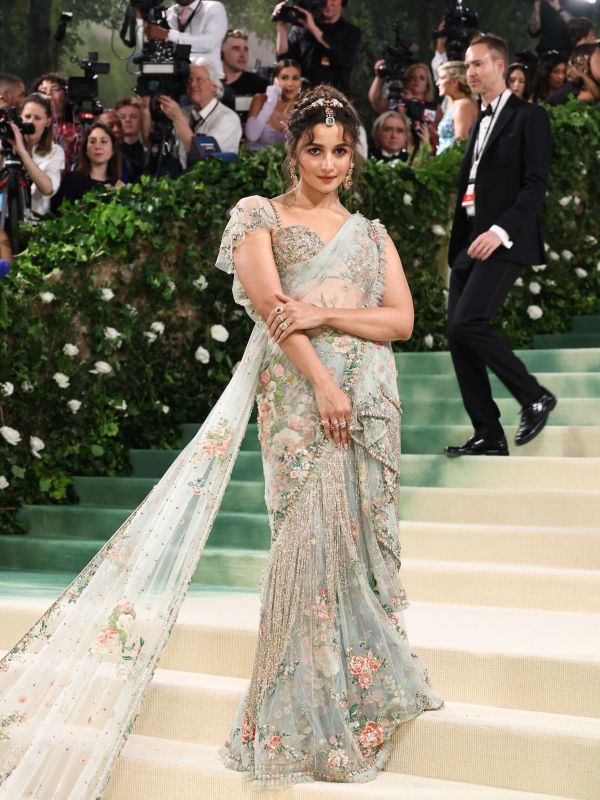 Image may contain Alia Bhatt Person Adult Clothing Footwear Shoe Wedding Child Accessories Formal Wear Tie and Camera