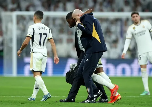 Soccer Football - LaLiga - Real Madrid v Villarreal - Santiago Bernabeu, Madrid, Spain - December 17, 2023 Real Madrid's David Alaba receives medical attention after sustaining an injury REUTERS/Isabel Infantes