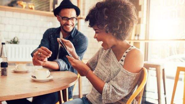 woman looking at pictures of trip as benefit to add years to her life