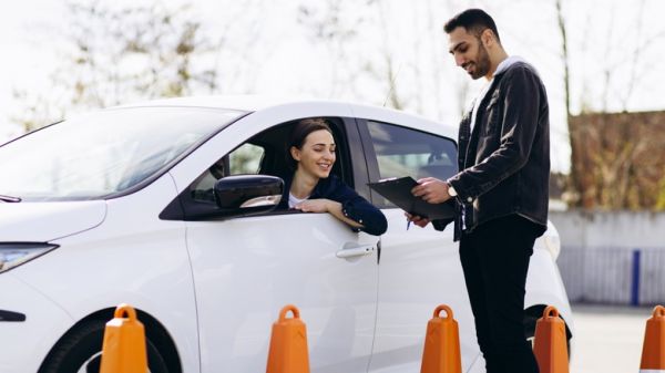 Woman passing driving test at driving school