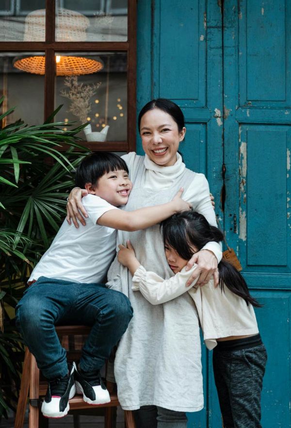 mom hugging her kids