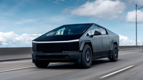 Black colored Cybertruck cruising on highway