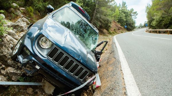 jeep wrangler crashed on side of the road