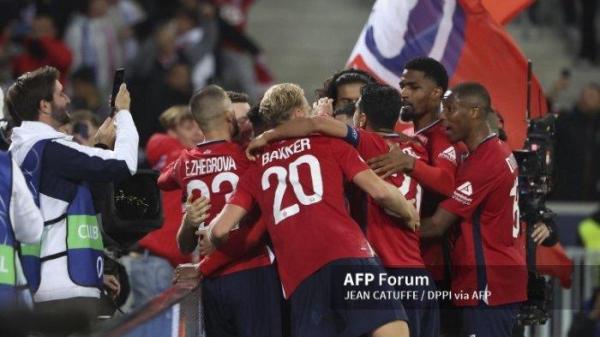 Jonathan David dari Lille merayakan golnya melalui tendangan penalti bersama rekan satu timnya selama pertandingan sepak bola Liga Champions UEFA, fase La Liga, Matchday 2 antara Lille OSC (LOSC) dan Real Madrid pada 2 Oktober 2024 di Stade Pierre Mauroy, Decathlon Arena di Villeneuve-d'Ascq dekat Lille, Prancis - Foto Jean Catuffe / DPPI