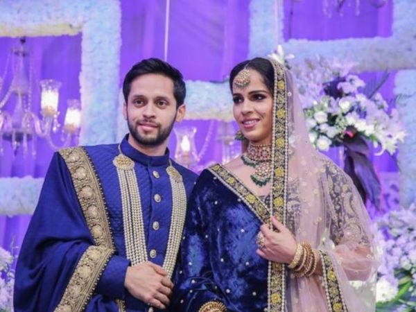 Saina wore a blue lehenga at the reception and her husband wore a blue sherwani.
