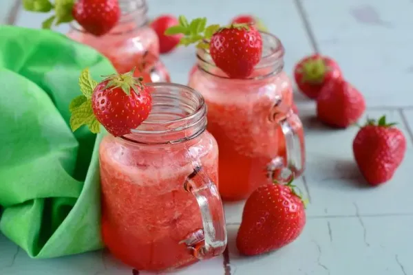 Fresh strawberry juice with mint leaf in a jar