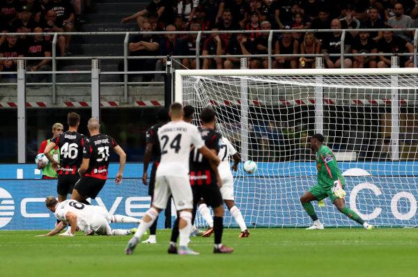 MILAN, ITALY - AUGUST 23: Federico Baschirotto of Cremonese scores his team's first goal during the Serie A match between AC Milan and US Cremonese at Giuseppe Meazza Stadium on August 23, 2025 in Milan, Italy. (Photo by Marco Luzzani/Getty Images)