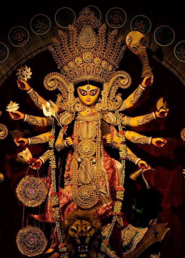 This may contain: an elaborately decorated statue in the middle of a room