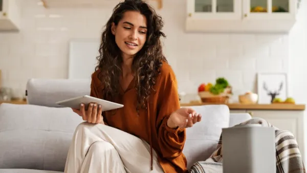 woman holding tablet Smart Home Audio