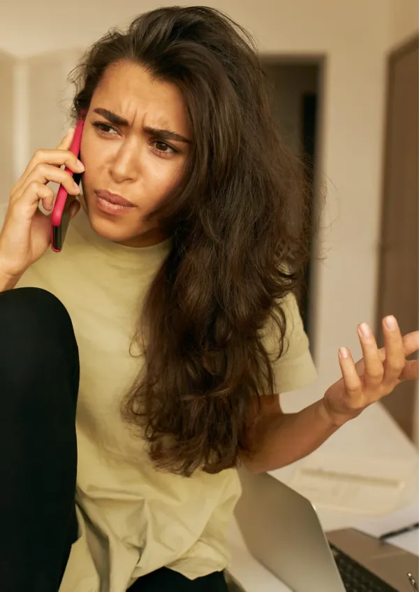 woman talking with her hands while on the phone