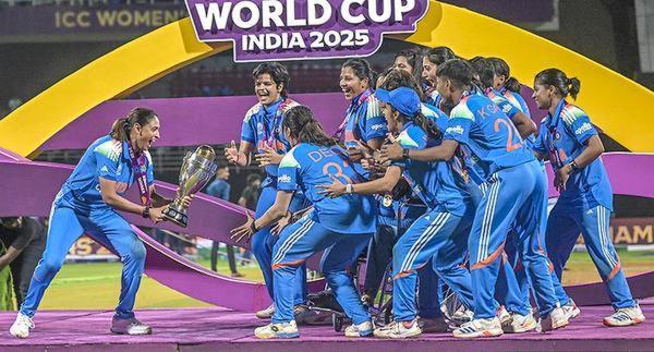 Indian women’s team captain carries the ODI World Cup trophy towards her teammates after beating South Africa in the final. 
