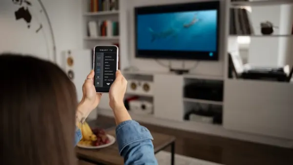 Woman Using Smart TV Remote