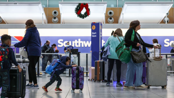 Travelers walk through the Southwest Airlines terminal at the Baltimore/Washington International Thurgood Marshall Airport