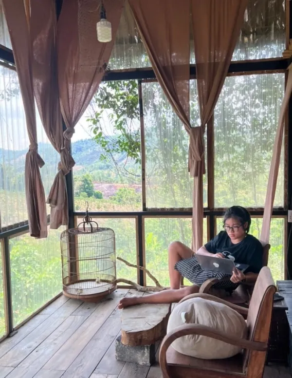 Phan Anh studies online while taking part in hands-on activities during summer 2025. Photo courtesy of Duong