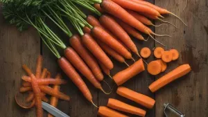 Fresh carrots on a wooden surface