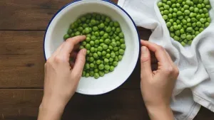Fresh green peas in bowl