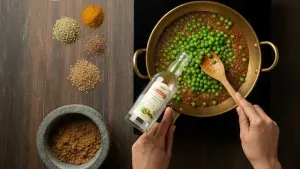 Adding vinegar to peas curry