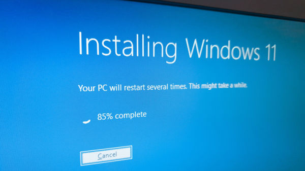 A close-up of a monitor displaying a later point in the Windows 11 installation