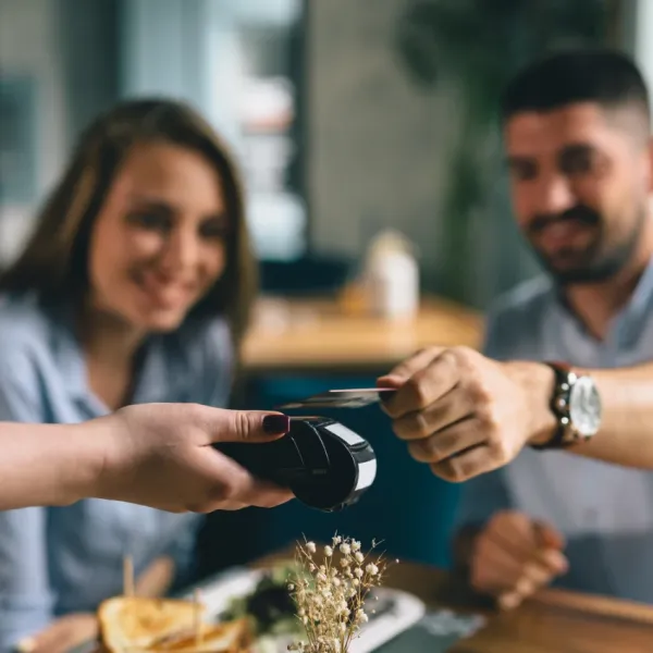 man tipping server at restaurant 