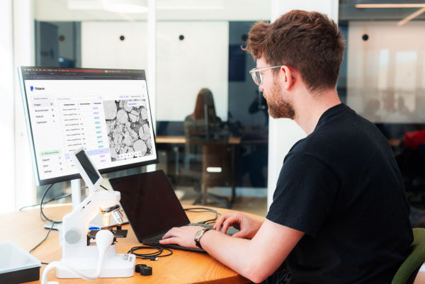 A person sitting at a desk using a computerAI-generated content may be incorrect.