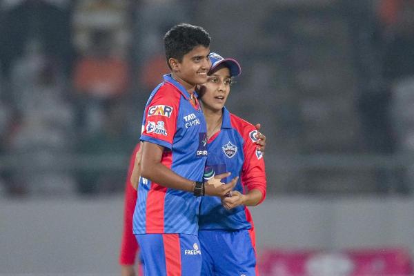 DC’s Charani celebrates the wicket of Gujarat Giants' Kashvee Gautam with captain Jemimah Rodrigues.