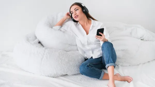 cute-girl-staying-bed-listening-music