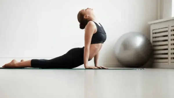 woman doing bhujangasan