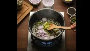 Chopped green chilies, grated ginger, and sliced ​​onions being lightly sautéed in oil until soft.